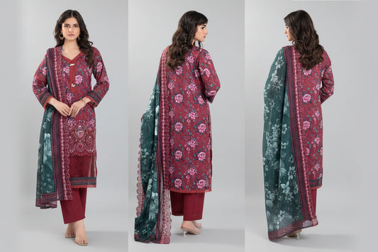 Woman wearing a red floral dress with green dupatta on a white background