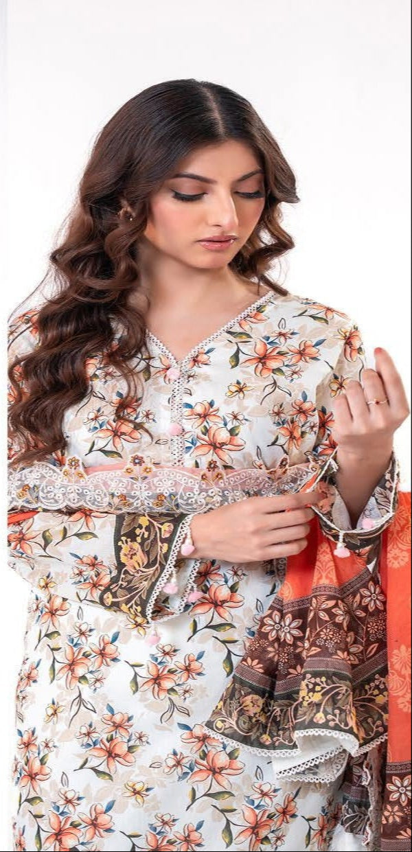 Woman wearing a traditional outfit with an orange and floral patterned dupatta.