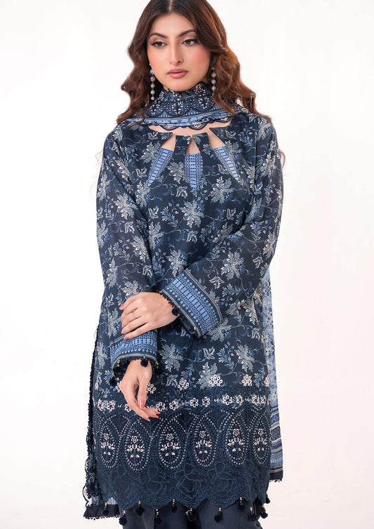Woman wearing a dark blue embroidered traditional outfit on a white background
