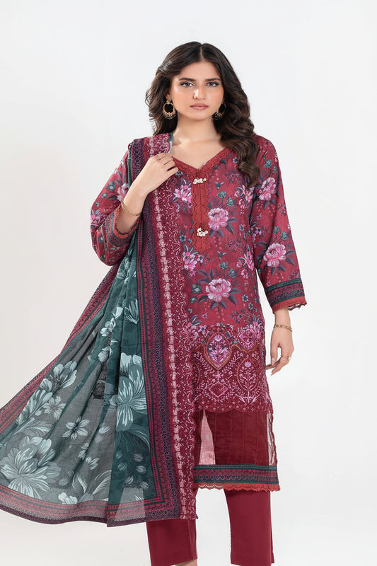 Woman modeling a traditional outfit with floral patterns on a white background