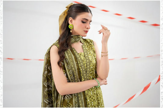 Woman wearing a green traditional outfit with a matching dupatta against a white background.