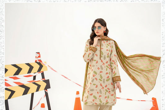 Woman modeling a traditional outfit with a patterned shirt and long jacket, standing on a white background.